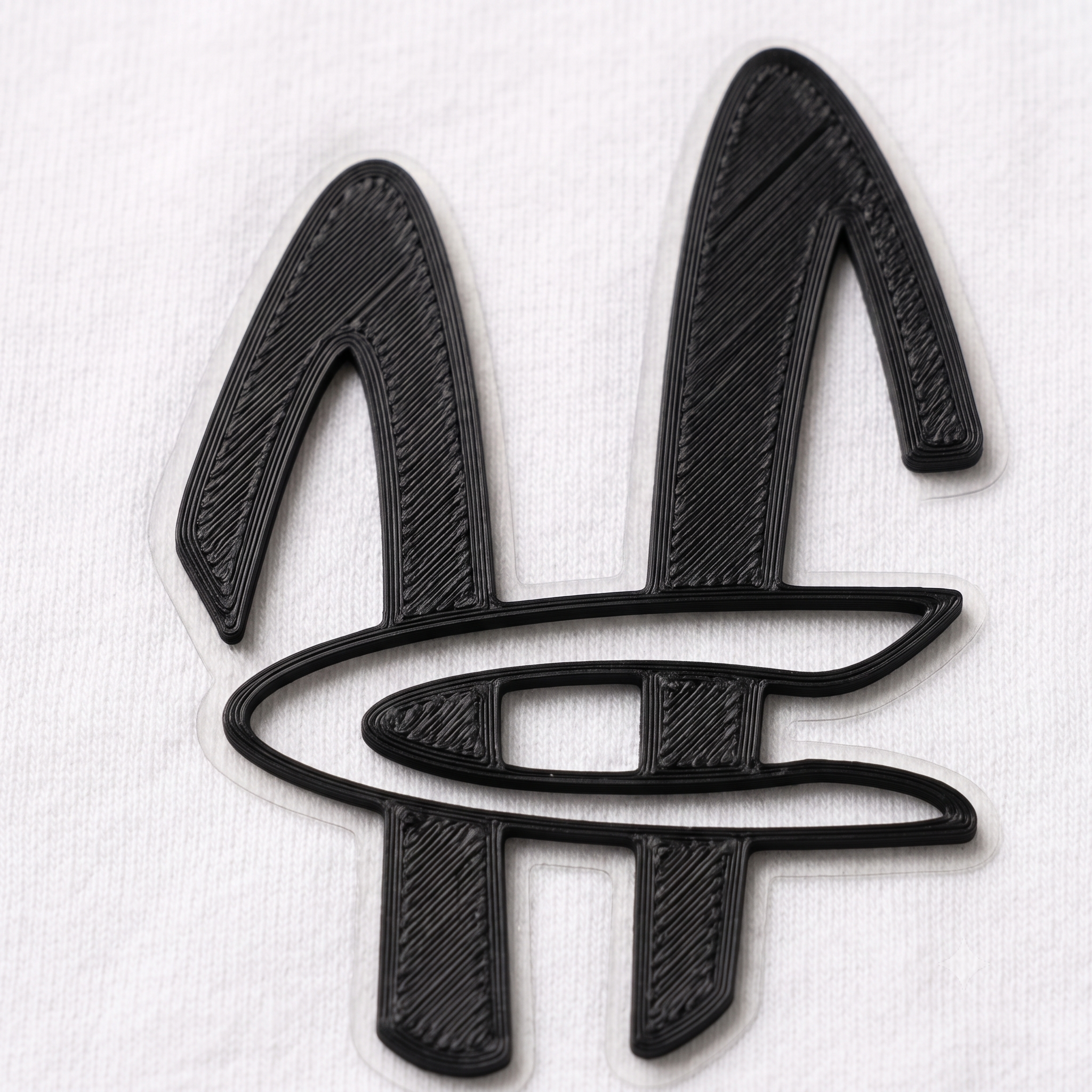 The HC logo, 3D printed